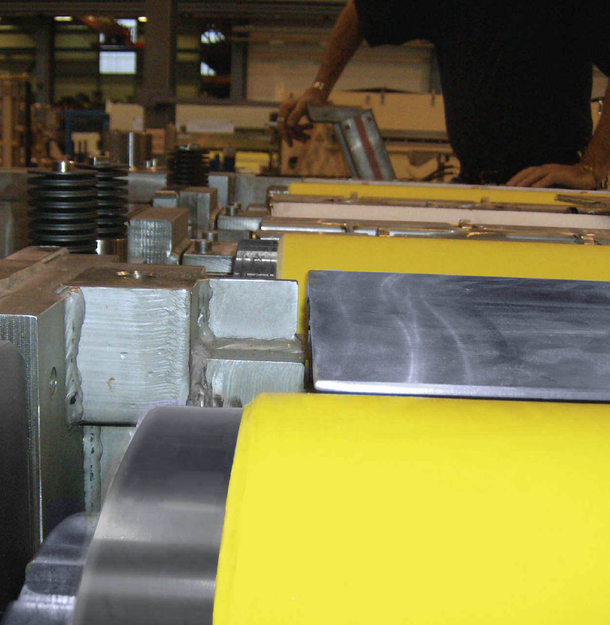 Two NCCM<sup>®</sup> Premier Yellow rolls in an opened blank washer