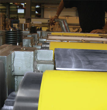 Two NCCM<sup>®</sup> Premier Yellow rolls in an opened blank washer