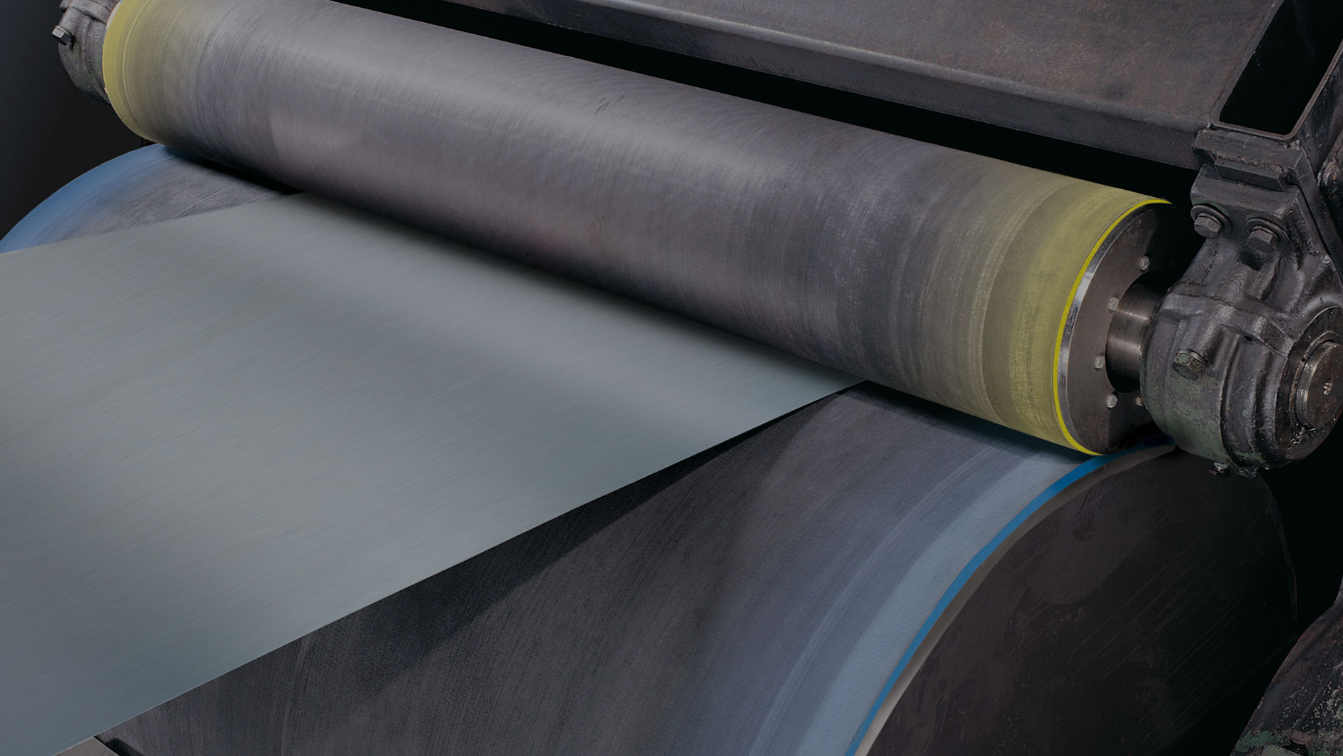 A metal strip running through an NCCM<sup>®</sup> Premier Yellow roll and RK roll.